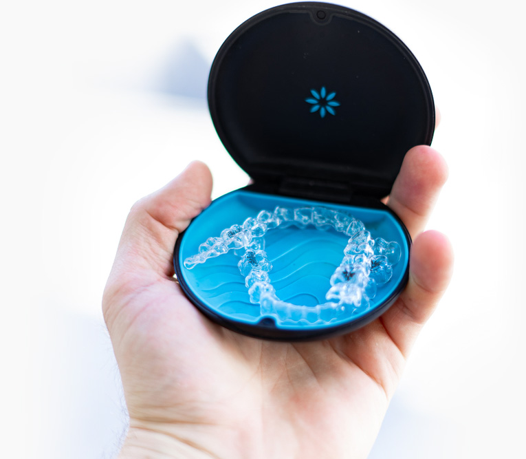hand holding invisalign