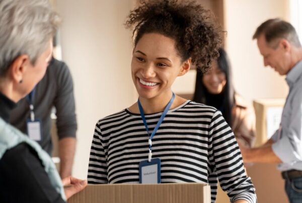 A woman volunteering at a holiday drive, one of the ways to give back to the community during the holidays in El Dorado Hills, CA